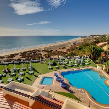 loveholidays ad — sun, sea and pool views await your next holiday